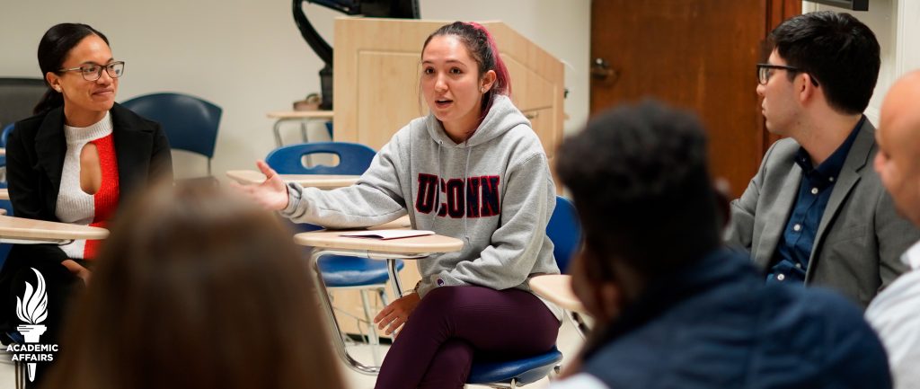 Students in Academic Affairs Committee Meeting engaged in discussion. 