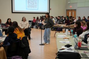 Photo of a student speaking at a USG Senate meeting