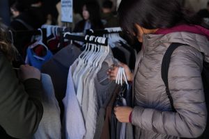 Photo of a woman looking through clothes