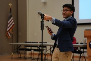 A photo of Student Services director, Jibreel Akbar, at a USG Senate meeting