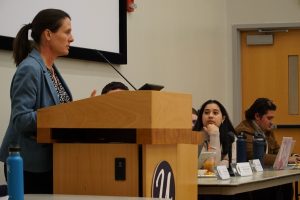 A photo of someone speaking at a USG Senate meeting